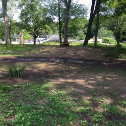 A few muddy areas after heavy rainfall, other than needing mowing, clean park with nice big shady trees around.