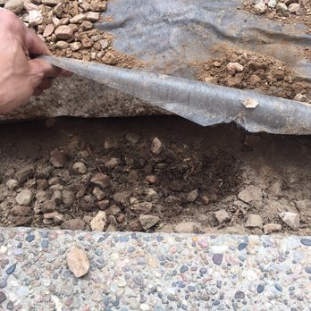 Martinez Design & Scape - Old rock underneath fabric. Failed to remove anything. - Tree Services Near Me