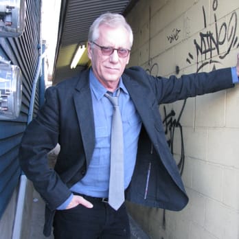 Honey Dew Donuts - a man leaning against a wall - Donuts Near Me - Warwick, Rhode Island
