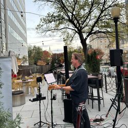Music by Harrison - When the weather is nice I play outside and I can see our nations capitol while I'm performing. The food and the crowd is excellent and fun!