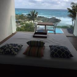 Hotel Secreto - Outdoor patio has an outdoor bed, table and chairs for each unit, and a great view of the ocean
