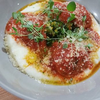 The Restorative - Bacon meatballs with polenta. AND THE POLENTA IS RIDICULOUS. Definitely not the dry polenta cake you're used to. - New American Near Me - Dunedin, Florida
