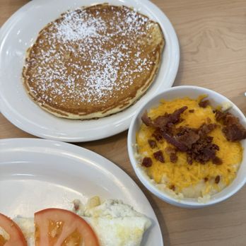 Eggs Up Grill - Goodness Gracious Omelet (I subbed mushrooms for peppers, and feta cheese for Swiss cheese). Garlic and cheese grits and side of pancake. - Breakfast & Brunch Near Me - McDonough, Georgia Eggs Up Grill - Goodness Gracious Omelet (I subbed mushrooms for peppers, and feta cheese for Swiss cheese). Garlic and cheese grits and side of pancake. - Breakfast & Brunch Near Me - McDonough, Georgia