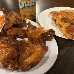 Varsity Pizza - Wings and a slice.
