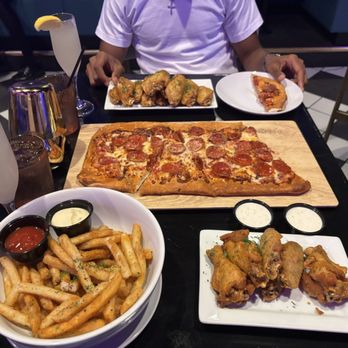 Atlas Ultra Lounge - $10 fries (shareable), Cajun ranch wings, hot honey pepperoni pizza - Lounges Near Me - Houston, Texas Atlas Ultra Lounge - $10 fries (shareable), Cajun ranch wings, hot honey pepperoni pizza - Lounges Near Me - Houston, Texas