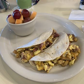 The Toasted Yolk Cafe - My breakfast tacos--no onions--and a lovely fruit cup! - Breakfast & Brunch Near Me - Fleming Island, Florida
