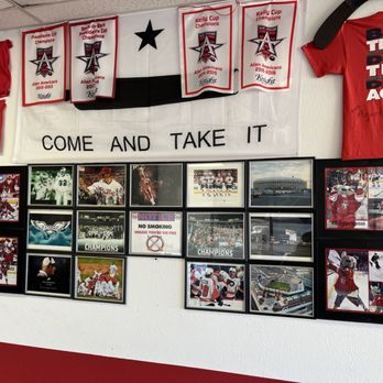 Fred's Downtown Philly - a wall of sports memorabilia - Cheesesteaks Near Me - Allen, Texas