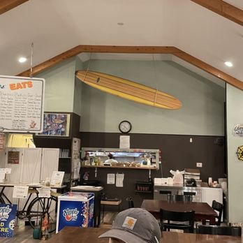 SharkBites - a surfboard hanging from the ceiling - Fish & Chips Near Me - Coos Bay, Oregon