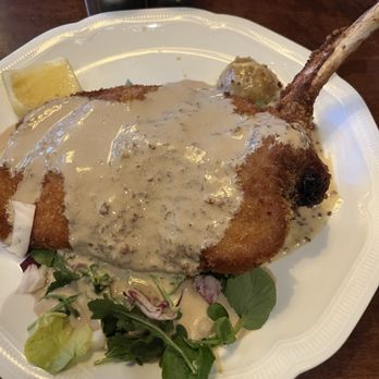 WALLISER STUBE - Schnitzel w/mushroom gravy on top - Fondue Near Me - Lake Louise, Alberta WALLISER STUBE - Schnitzel w/mushroom gravy on top - Fondue Near Me - Lake Louise, Alberta