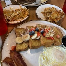 French toast with fruit, hashbrowns, eggs, bacon, and sausage French toast with fruit, hashbrowns, eggs, bacon, and sausage