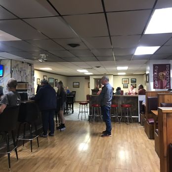 John Henry's Restaurant & Casino - people at the bar - Pizza Near Me - Choteau, Montana John Henry's Restaurant & Casino - people at the bar - Pizza Near Me - Choteau, Montana