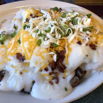 Brother Juniper's - Fully loaded biscuits and gravy (eggs over medium) - Breakfast & Brunch Near Me - Memphis, Tennessee Brother Juniper's - Fully loaded biscuits and gravy (eggs over medium) - Breakfast & Brunch Near Me - Memphis, Tennessee