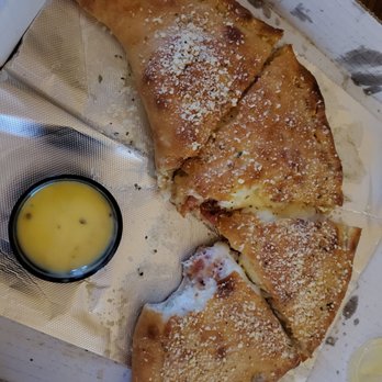 Bruno's Pizza Downtown - Chicken bacon ranch calzone and garlic butter - Pizza Near Me - South Bend, Indiana Bruno's Pizza Downtown - Chicken bacon ranch calzone and garlic butter - Pizza Near Me - South Bend, Indiana