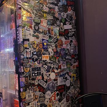 The 4th Horseman - Beer fridge covered in stickers - Pizza Near Me - Long Beach, California The 4th Horseman - Beer fridge covered in stickers - Pizza Near Me - Long Beach, California