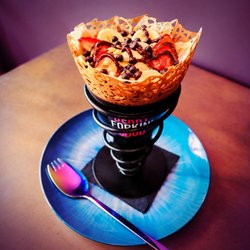 Berry Forkin' Good - Handcrafted gluten-free crêpe with strawberries, bananas, chocolate chips and chocolate drizzle at Berry Forkin' Good in Port St. Lucie.