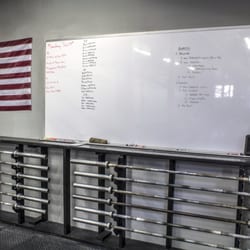 Crossfit Caldwell - Every workout starts at the Whiteboard. There the instructors give the class breakdown as well as some helpful strategies.