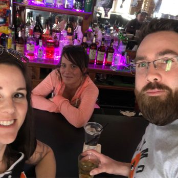 Chasers - a man and a woman sitting at a bar - Sports Bars Near Me - Baltimore, Maryland
