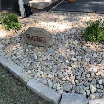 SES Landscape - a rock garden with a sign in the middle - Landscaping Near Me SES Landscape - a rock garden with a sign in the middle - Landscaping Near Me