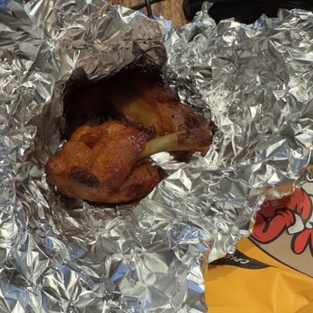 Crispy Burger - Two small chicken wings I think chicken thighs inside a foil - Chicken Shop Near Me - Queens, New York