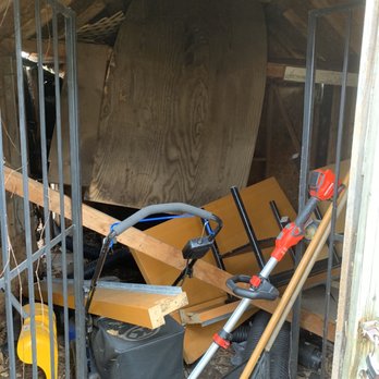Greens Junk Removal - "Loft area" had collapsed and posed a hazard. Shed was very old with rotted wood and rusted gates that wouldn't even close - Junk Removal & Hauling Near Me
