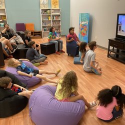 Kings Row Community Life Center - Watching a video on how to make solar s'more cookers!