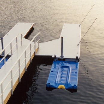 Mid Cal Construction - a dock with a boat and a raft - General Contractors Near Me - Stockton, California Mid Cal Construction - a dock with a boat and a raft - General Contractors Near Me - Stockton, California