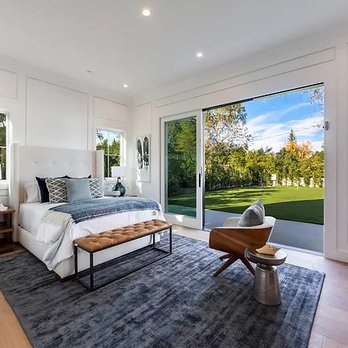 Future Home Builders - Newly built in Fremont. Bedroom with sliding door to outdoor area. - Home Developers Near Me - Reseda, California