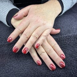 Ambitions Nail & Hair Studio - Red Chrome with white sparkles perfect for the holidays.