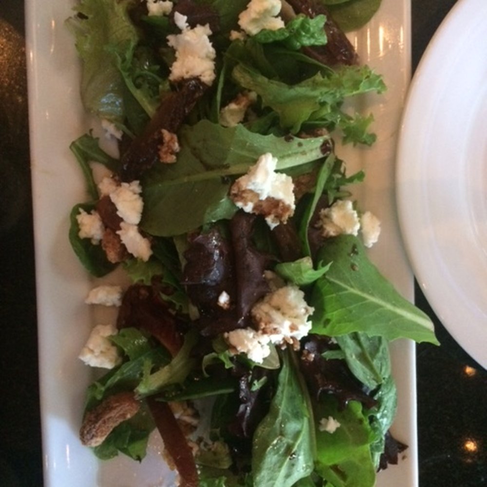 Roaring Fork - Medjool salad has dates, goat cheese, fig and candied walnuts. - New American Near Me - Austin, Texas