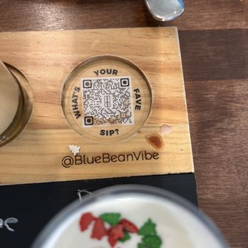 Blue Bean - a cup of coffee with a qr code on it - Coffee & Tea Near Me - Ankeny, Iowa