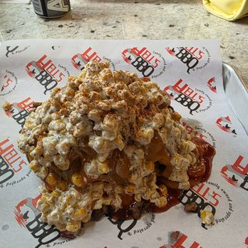Hell's BBQ - This was there special mfv loaded baked potato with brisket and elote. This thing was huge - Barbeque Near Me - Oswego , Illinois Hell's BBQ - This was there special mfv loaded baked potato with brisket and elote. This thing was huge - Barbeque Near Me - Oswego , Illinois