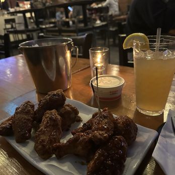 Bonchon 32nd st - Bone in Wings w/ Soy/Garlic- Left, and Tangy sweetened version -Right - Chicken Wings Near Me - New York, New York Bonchon 32nd st - Bone in Wings w/ Soy/Garlic- Left, and Tangy sweetened version -Right - Chicken Wings Near Me - New York, New York