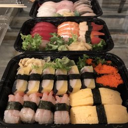 Amaebi Sweet Shrimp, Herring, Tamago, and Flying Fish Roe sushi in foreground Amaebi Sweet Shrimp, Herring, Tamago, and Flying Fish Roe sushi in foreground