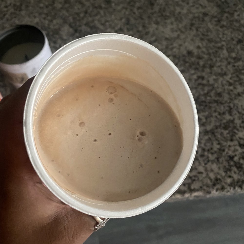 a person holding a cup of coffee a person holding a cup of coffee