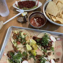 Mix of tacos. Served almost cold and it looks like imitation bacon bits on the "fresh" guacamole. Mix of tacos. Served almost cold and it looks like imitation bacon bits on the "fresh" guacamole.
