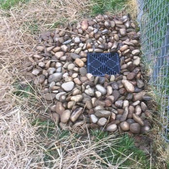 Brad's Lawn Service - a drain in the grass - Landscaping Near Me - Browns Summit, North Carolina