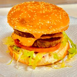 Giuseppe's Pizzeria - Giuseppe's beast burger - towering feast of juicy, hand-formed patties, melted cheese, crispy bacon, and fresh toppings, all sandwiched betw