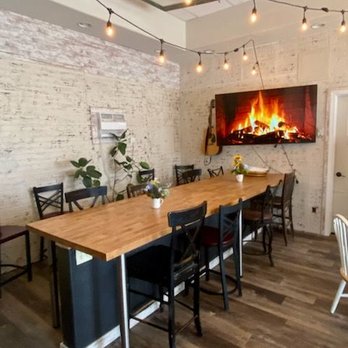Winnie's - a dining room with a fireplace in the background - Coffee & Tea Near Me - Spearfish, South Dakota Winnie's - a dining room with a fireplace in the background - Coffee & Tea Near Me - Spearfish, South Dakota