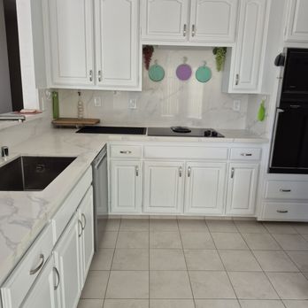 Juan Carlos construction - Kitchen Cabinets after repainting - General Contractors Near Me
