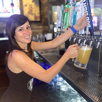 PT's Pub - a woman filling a pint of beer - Pubs Near Me - Las Vegas, Nevada PT's Pub - a woman filling a pint of beer - Pubs Near Me - Las Vegas, Nevada