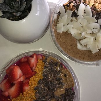 Zest Juice - An acai bliss bowl (topped with PB, coconut flakes, granola) and dragon fruit bowl (topped with PB, strawberries, bee pollen, cacao). - Juice Bars & Smoothies Near Me - Columbus, Ohio