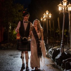 Sacred Harbor Photography - Despite the drizzle, newlyweds walk holding lanterns along Eola Hills Winery's walking path.