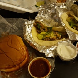 Quintero's Taqueria - BBQ pork sandwich and 2 pork tacos. Sides of spicy Chipotle BBQ, sour cream, and salsa.