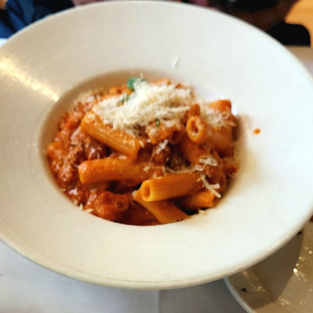 Cucina Paradiso - Rigatoni Alla Carcerata. It had rigatoni pasta in a light tomato cream sauce with sausage, roasted peppers, and peas. - Italian Near Me - Petaluma, California