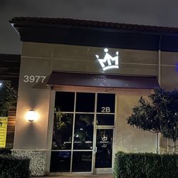 Mike Metz Indoor Golf Studio - Sign of crown logo above storefront