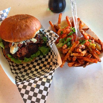 Rustic On the Green - Burger with blue cheese and bacon and sweet potato fries with queso and green chile sauce - New American Near Me - Albuquerque, New Mexico