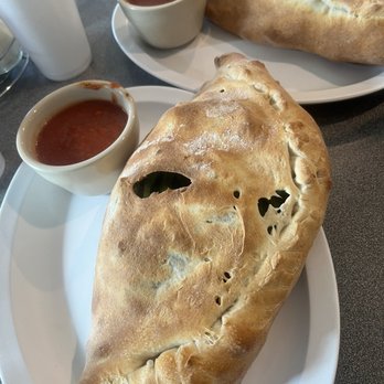 Martinho's Bakery and Deli - Calzone up close, stromboli in back - Pizza Near Me - Mebane, North Carolina Martinho's Bakery and Deli - Calzone up close, stromboli in back - Pizza Near Me - Mebane, North Carolina