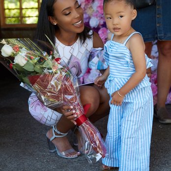 True Nannies - Owner of True Nannies receives flowers at launch party - Nanny Services Near Me True Nannies - Owner of True Nannies receives flowers at launch party - Nanny Services Near Me