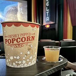 Fresh popcorn (with real butter) and a cold beer in a comfy leather recliner. Fresh popcorn (with real butter) and a cold beer in a comfy leather recliner.
