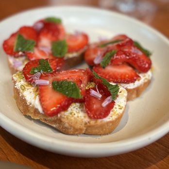 The Wolf - Strawberry Crostini - sweetness of the strawberries and honey perfectly offset the savory richness of the whipped feta - New American Near Me - Oakland, California